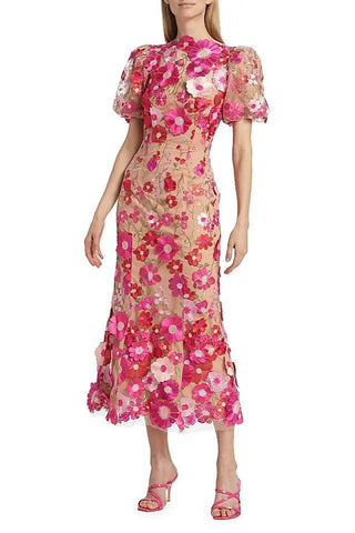 Woman wearing a floral dress on a white background