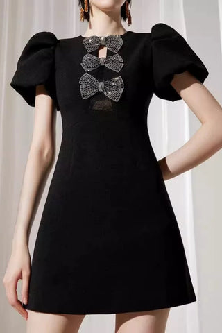 vanessa bow puff sleeve mini dress in black