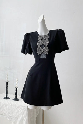 vanessa bow puff sleeve mini dress in black