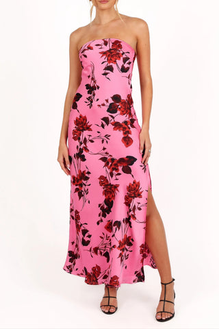 A strapless maxi dress in rose pink with a floral print, featuring a straight neckline and a side split detail.