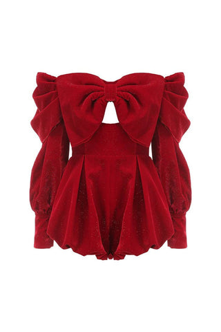 Red velvet top with a large bow on a white background