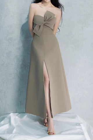 A strapless, bowknot detailed midi dress in a grey-green color with a slit on the left side, displayed on a plain background.