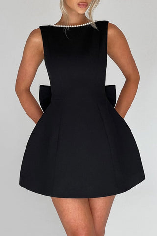 TRISTA BOWKNOT PEARL BACKLESS MINI DRESS IN BLACK