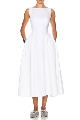 Woman wearing a white dress on a white background